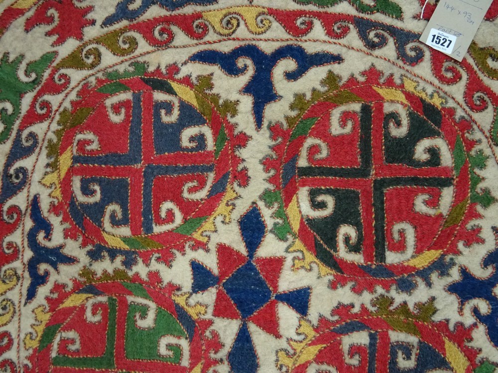 An Uzbek felt saddle cloth, the ivory field with two column of four cross roundels, - Image 3 of 6