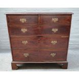 A mid-18th century mahogany and oak chest of two short and three long graduated drawers,