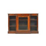 A William IV rosewood floor standing breakfront bookcase, with glazed central door,