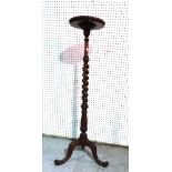 A Regency style mahogany jardiniere stand on barleytwisted column and three downswept carved