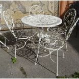 A 20th century white painted metal circular garden table together with a set of four wirework