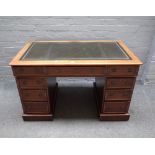 A Victorian mahogany pedestal desk, with nine drawers about the knee, on plinth base,