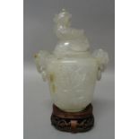 A small Chinese agate two-handled vase and cover of light grey tone with russet inclusions,