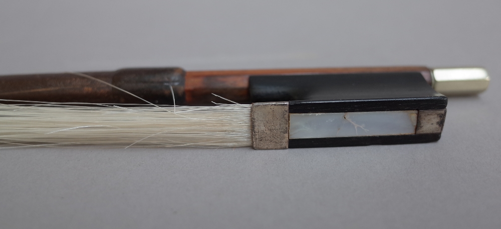 A French silver mounted violin bow stamped 'D'APRES SIMON', - Image 2 of 2