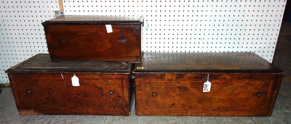 Three rectangular walnut and crossbanded music box cases (lacking movements).