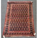 A Sarough rug, Persian, repeat boteh on black field, boteh border, 134 x 200cm.