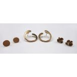 A pair of 9ct gold earrings, each in a tapering twisted hoop shaped design,