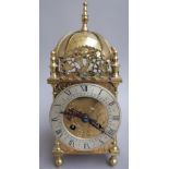 A 17th century style brass lantern clock, with French 8 day movement, 25cm high.