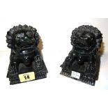 A pair of Chinese green hardstone carved dogs of Fo, each on a rectangular plinth, 11.5cm wide, (2).