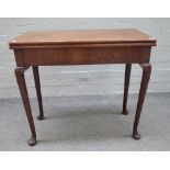 A mid-18th century walnut rectangular tea table, on club supports,