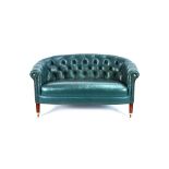 A small George III style green leather upholstered tub back sofa,