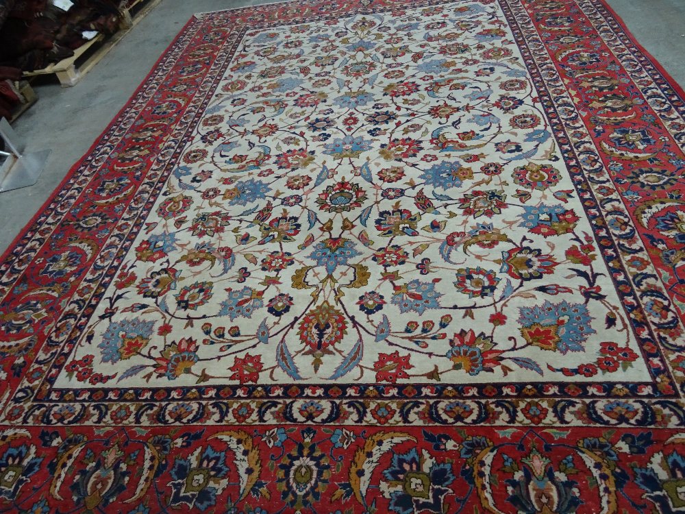 Isfahan carpet, Persian, the ivory field with all over palmette and floral sprays, - Image 2 of 6