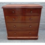 A Victorian mahogany chest of two short and three long graduated drawers, on plinth base,
