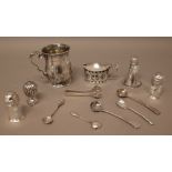 Silver, comprising; a baluster shaped mug, with a scrolling handle, on a circular foot,