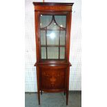 An Edwardian mahogany inlaid display cabinet with cupboard base on tapering square supports,