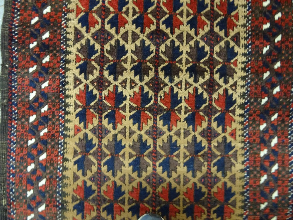 A Beluchistan prayer rug, the pale brown mehrab with matching three columns of flowering spandrels, - Image 4 of 4