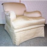 A 20th century low armchair with rollover arms and cream upholstery,