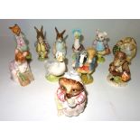 Beatrix Potter; a group of eleven Royal Albert figurines, including Hunca Munca, Flopsy Bunny,