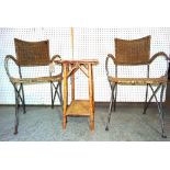 A pair of 20th century wrought iron and rattan open armchairs and a 20th century bamboo two tier