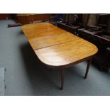 A George III satinwood inlaid mahogany triple section extending dining table,