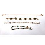 A gold bracelet, spaced with dyed green chalcedony beads, alternating with cultured pearls,