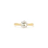 A gold and diamond single stone ring, claw set with a cushion shaped diamond,