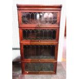The Globe-Wernicke Co Ltd; an oak four section bookcase, with leaded glazed doors,