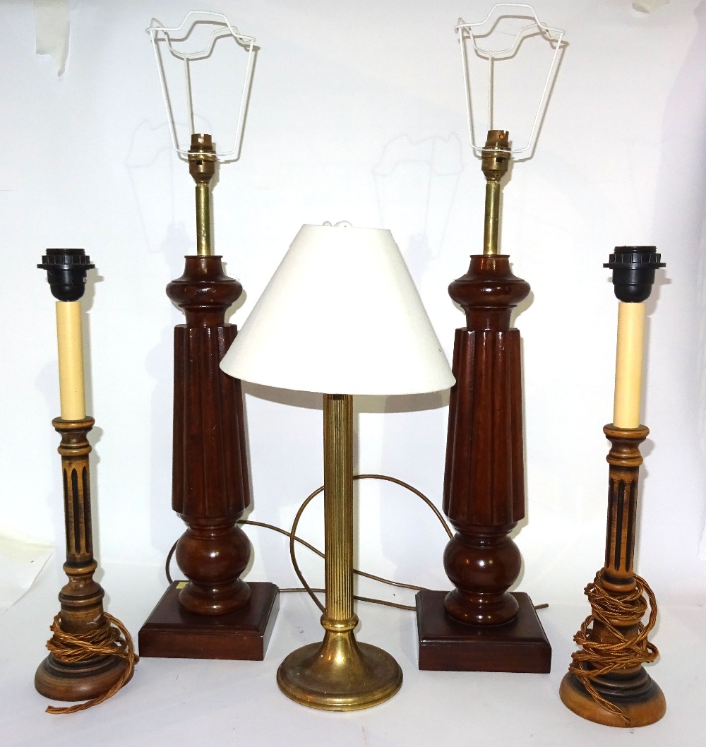 A pair of 20th century mahogany table lamps on reeded tapering columns, 60cm high,