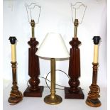 A pair of 20th century mahogany table lamps on reeded tapering columns, 60cm high,