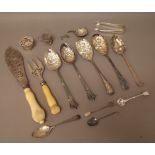 Silver and silver mounted wares, comprising; a bottom marked berry fruit spoon, a glass tot stand,