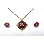 A 9ct gold, red and white enamelled pendant,