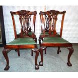 A set of four George III style mahogany dining chairs on ball and claw feet, (4).