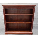 A Victorian mahogany floor standing open bookcase, with pair of adjustable shelves, on plinth base,