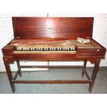An early 20th century mahogany framed clavichord of small rectangular proportions, 127cm wide.