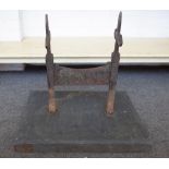 A Victorian Gothic revival cast iron boot scraper on later slate base, 49cm wide x 45cm high.