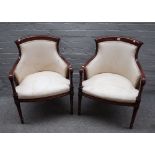 A pair of mahogany framed tub back open armchairs, on turned supports, 61cm wide x 85cm high (2).