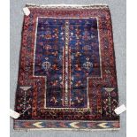 A Beluchistan prayer rug, the indigo mehrab with a tree of life,