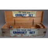 A Jaques vintage 'The Small Club' croquet set, comprising; four wooden mallets, four coloured balls,