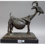 A late 20th century patinated bronze model of a goat, unsigned,