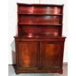 A 19th century mahogany bookcase cabinet with single frieze drawer over panelled doors on bun feet,