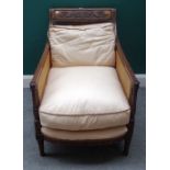 A late 19th century carved mahogany famed easy armchair,