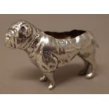 A silver pin cushion frame, modelled as a standing dog, (the upholstery lacking),