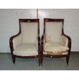 A pair of 19th century French Empire mahogany framed armchairs on tapering square supports,