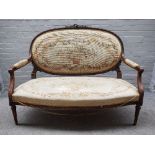 A Louis XVI style carved and stained beech salon suite comprising; a sofa, 140cm wide x 107cm high,