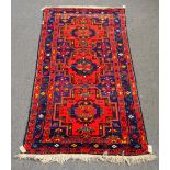 A modern Caucasian rug of Kazak design, 287cm x 150cm.