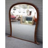 A late 19th century gilt framed balloon shaped overmantel mirror with egg and dart moulded frame,