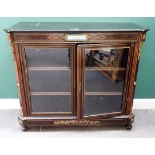 A mid-Victorian gilt metal and ceramic mounted ebonised glazed two door display cabinet,