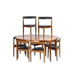 HANS OLSEN FOR FREM ROJLE; a 1960s teak circular extending dining table on tapering turned supports,