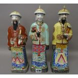 Three Chinese famille-rose figures of officials, 20th century,