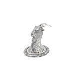 A silver pepperette, designed as the head of a goat,